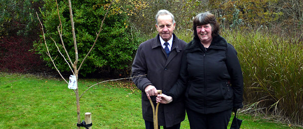 Ian's father John and wife Maria after the planting of Prunus Chocolate Ice
